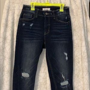 Mid rise dark ripped jeans